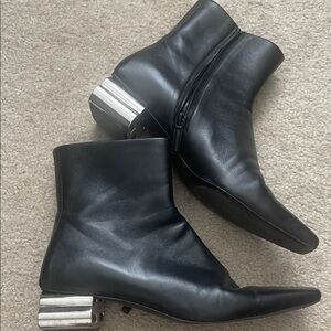 Sleek Black Ankle Boots with Metallic Heel
